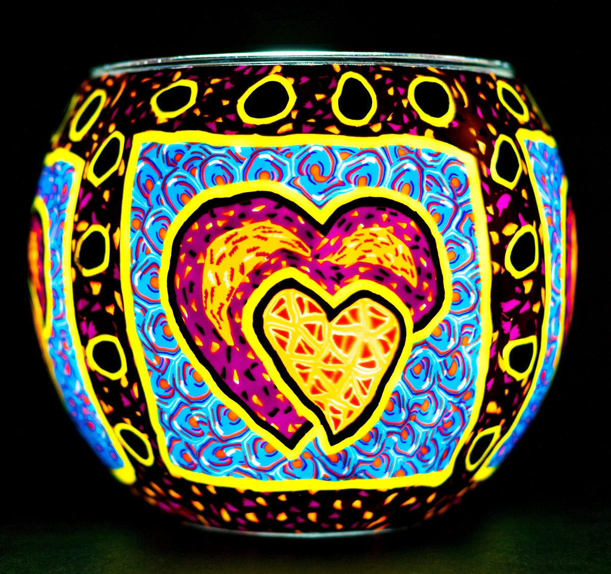 Pair of Hearts Claymaster light globe glowing with two nested hearts in magenta, orange and gold on swirling blue rosettes