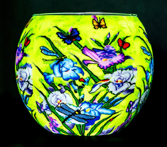 Nature's Garden Claymaster light globe glowing chartreuse with irises, butterflies and teal dragonflies across the surface