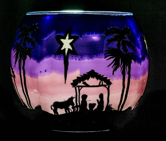 A Child is Born Claymaster light globe glowing with a nativity silhouette under the Star of Bethlehem against a violet-to-pink sky
