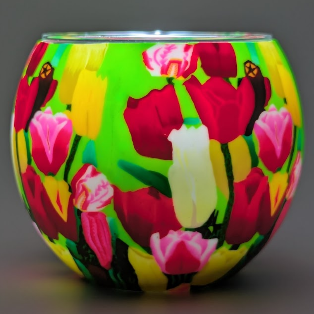 Colorful glass globe with floral design on a dark background