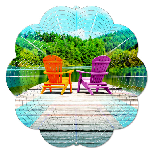 Muskoka chairs wind spinner showing orange and purple chairs on a lakeside dock, 12-inch scalloped design